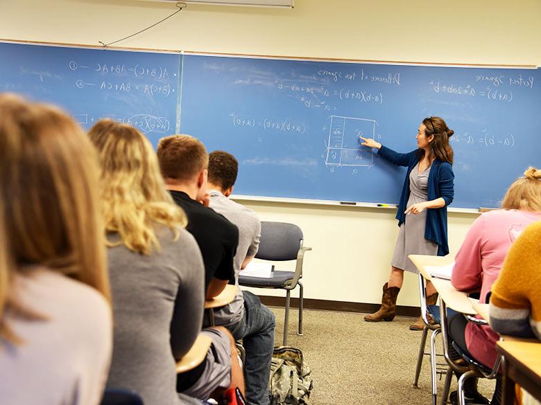 A female instructor teaching a course