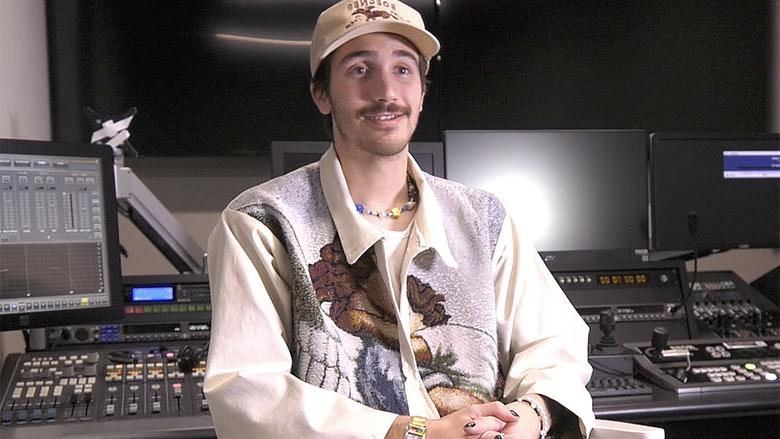 Noah Riffe seated in a TV studio